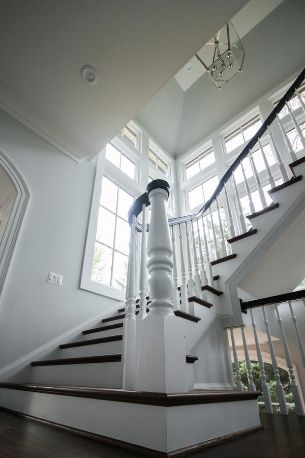 Powerful Impression by Floating Staircase in Suburban Foyer