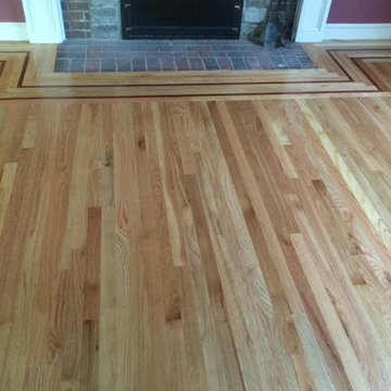 Newly installed 2 1/4" Red Oak hardwood floor with inlay