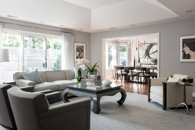 Living room - mid-sized transitional formal and enclosed dark wood floor and brown floor living room idea in Boston with beige walls and no tv