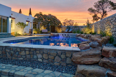 Mid-sized elegant backyard concrete and custom-shaped natural pool landscaping photo in Other