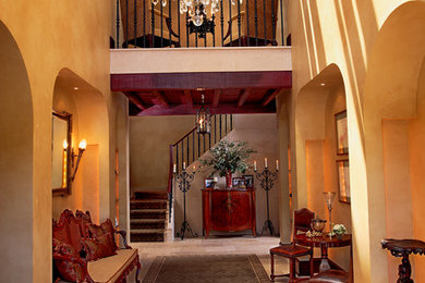 Foyer - large mediterranean foyer idea in New York with beige walls