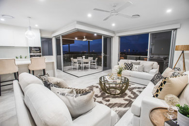 Photo of a mid-sized contemporary open concept family room in Melbourne with white walls and white floor.