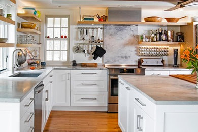 Open concept kitchen - mid-sized eclectic l-shaped medium tone wood floor open concept kitchen idea in Philadelphia with a single-bowl sink, shaker cabinets, white cabinets, quartzite countertops, stainless steel appliances and two islands