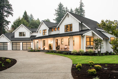 Inspiration for a cottage white two-story exterior home remodel in Seattle with a shingle roof