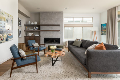 Design ideas for a mid-sized contemporary open concept living room in Seattle with white walls, medium hardwood floors, a tile fireplace surround, no tv, a ribbon fireplace and brown floor.