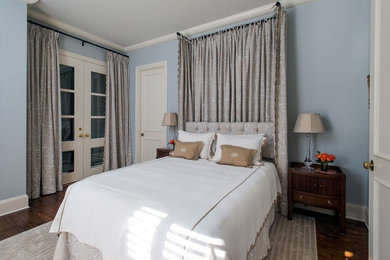 Inspiration for a transitional master medium tone wood floor and brown floor bedroom remodel in Nashville with blue walls