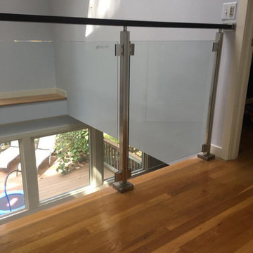 Modern railing system with tempered glass panels NJ