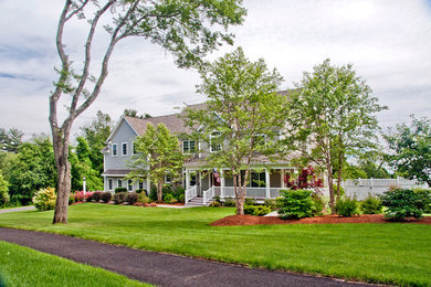 Large country beige two-story concrete fiberboard gable roof photo in Boston