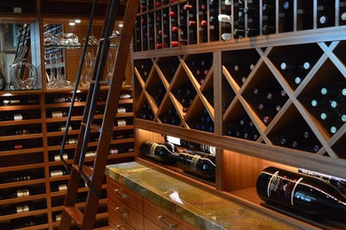 Design ideas for a large modern wine cellar in San Diego with terra-cotta floors and display racks.