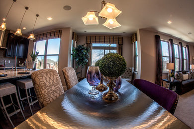 Example of a large trendy open concept light wood floor family room design in Detroit with gray walls and no fireplace