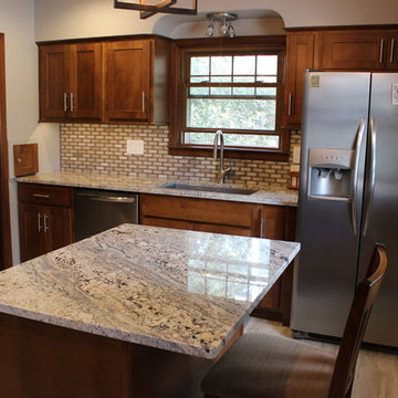 Kitchen With Unique Granite and Small Island in Moline, IL