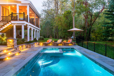 Inspiration for a mid-sized timeless backyard pool remodel in Philadelphia