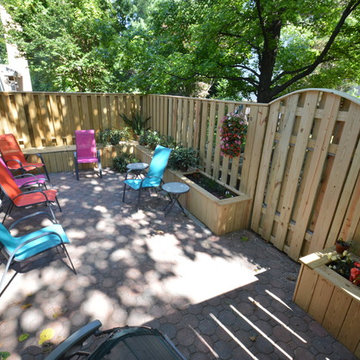 Townhouse patio with fence, benches and planter boxes