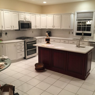 cabinet refacing--2 toned white with cherry island and quartz countertops
