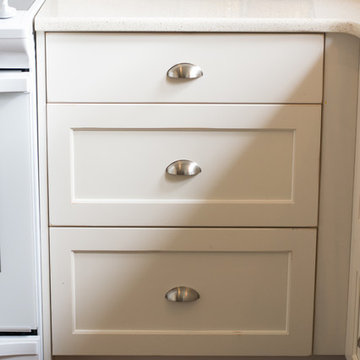 White Shabby Chic Kitchen with a Walnut Top