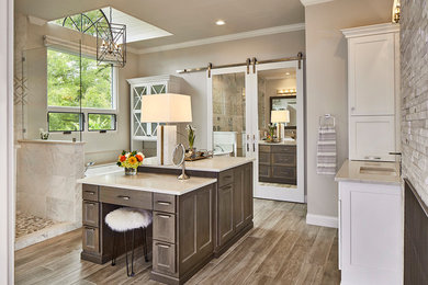 Photo of a large transitional master bathroom in Dallas with medium wood cabinets, white tile, beige walls, quartzite benchtops, brown floor, white benchtops, an open shower, medium hardwood floors, an undermount sink and recessed-panel cabinets.