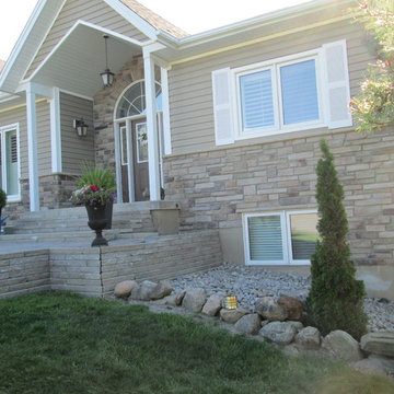 Updating an aluminum siding exterior using cultured stone veneer
