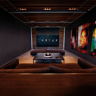 Inspiration for a contemporary beige floor home theater remodel in Boston with black walls