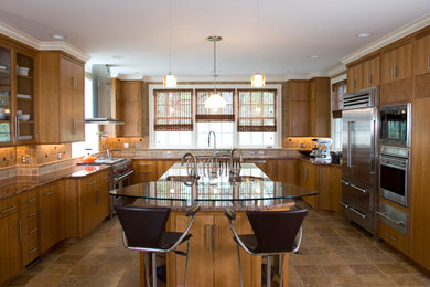 Enclosed kitchen - large contemporary u-shaped terra-cotta tile and multicolored floor enclosed kitchen idea in Other with a double-bowl sink, flat-panel cabinets, medium tone wood cabinets, granite countertops, brown backsplash, stone tile backsplash, stainless steel appliances and an island