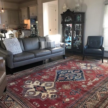 Kazak Oriental Rug radiates life into this living room space!