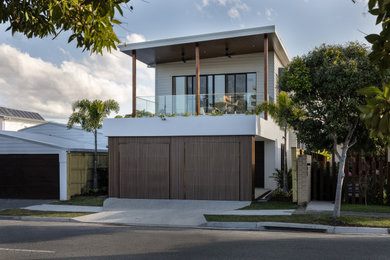 Inspiration for a contemporary two-storey multi-coloured duplex exterior in Gold Coast - Tweed.