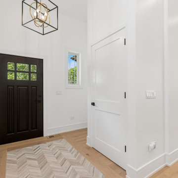 Tailored Modern Foyer with Bold Contrast and Organic Warmth
