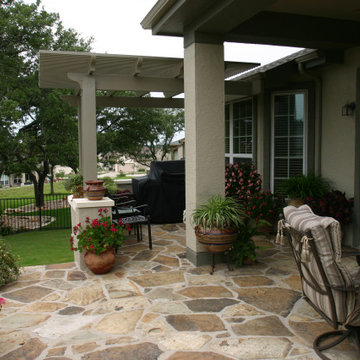 Chocolate / brown flagstone extension w/ stucco seatwalls and columns, Alumawood
