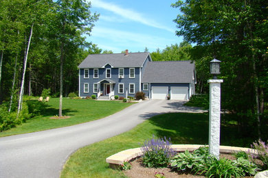 Inspiration for a large timeless blue two-story vinyl gable roof remodel in Portland Maine