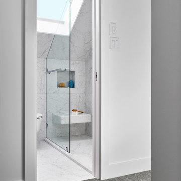 Luminous space thanks to new skylight. New hallway access with pocket door.