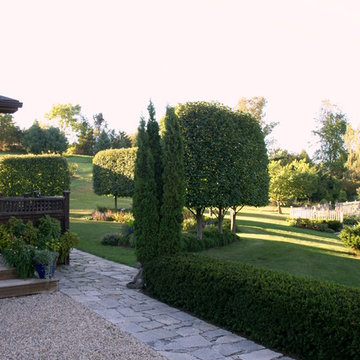 Granite and gravel with yew hedge