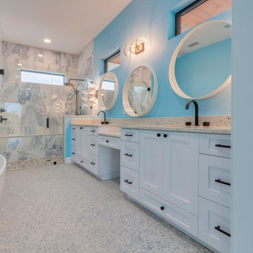 Vibrant Coastal Bathroom with Dual Vanity and Frameless Shower