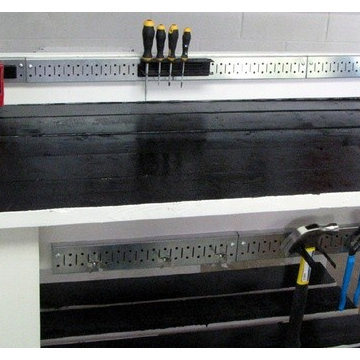 Wall Control pegboard strips can be mounted directly to workbenches to add tool