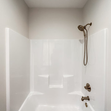 Bathroom shower and tub insert