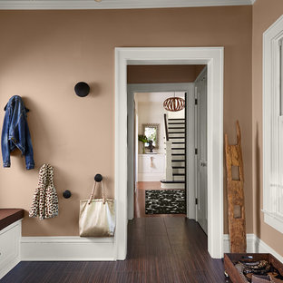 Example of a transitional ceramic floor and brown floor mudroom design in Chicago with brown walls