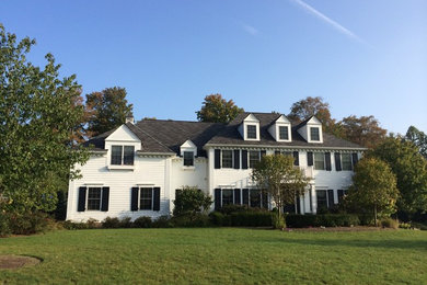 Large traditional two-story exterior home idea in Cleveland