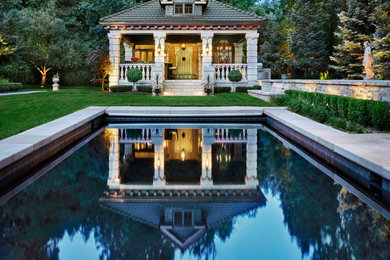This is an example of a mediterranean pool in Denver with a pool house.