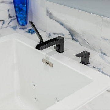 Bathroom remodeling in Columbia, MD with double vanity & marble bathtub