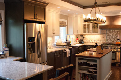 Inspiration for a mid-sized transitional u-shaped dark wood floor and brown floor enclosed kitchen remodel in New York with a farmhouse sink, recessed-panel cabinets, light wood cabinets, quartz countertops, beige backsplash, porcelain backsplash, stainless steel appliances and an island