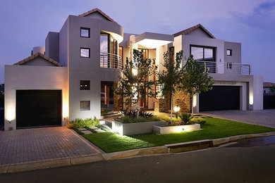 Example of a trendy home design design in Other