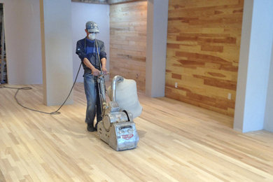 Sanding a floor before the final finish