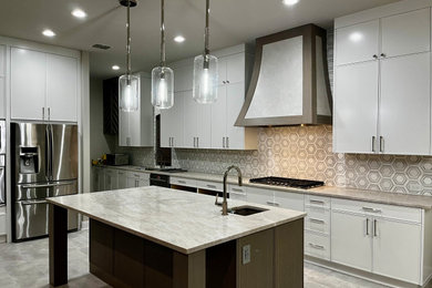 Example of a large minimalist l-shaped eat-in kitchen design in Dallas with shaker cabinets, white cabinets, quartzite countertops, marble backsplash and an island