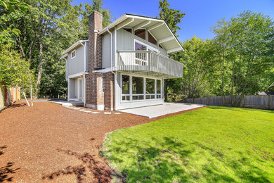 Mid-sized beach style gray two-story wood exterior home photo in Seattle with a shingle roof
