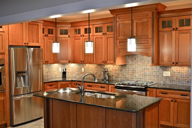 Eat-in kitchen - large craftsman u-shaped ceramic tile and beige floor eat-in kitchen idea in Other with a double-bowl sink, flat-panel cabinets, light wood cabinets, granite countertops, multicolored backsplash, slate backsplash, stainless steel appliances, an island and black countertops