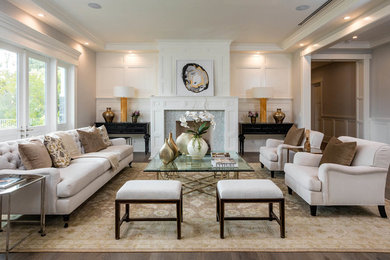 Transitional formal open concept living room in Los Angeles with white walls, medium hardwood floors and no tv.