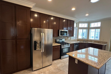 Example of a mid-sized transitional kitchen design in Orange County