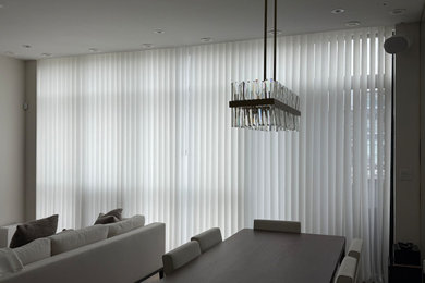 Example of a minimalist dining room design in Toronto