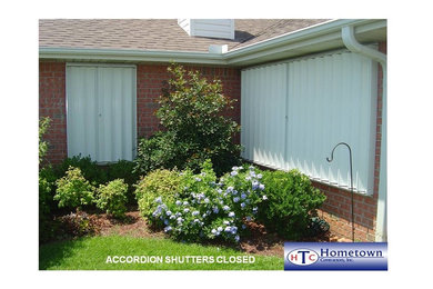 Pensacola & Destin Florida Storm Shutters Hometown Contractors Inc. 850.995.9947