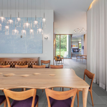 Dining Room with walnut wood hand-carved table that seats up to sixteen