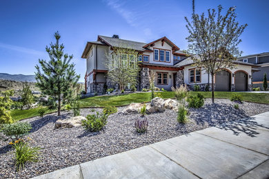 Huge craftsman beige three-story concrete fiberboard exterior home idea in Boise