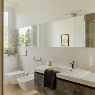 Casa O+C — Ristrutturazione e ampliamento di una villa immersa nel verde